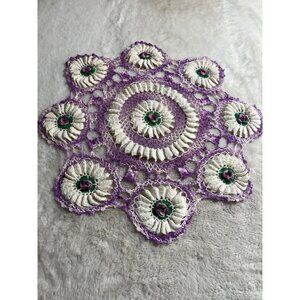 Crocheted purple flower rounded granny Doily